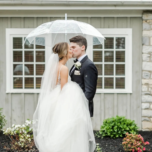 Couple Posing and Kissing under the Rain at Downingtown